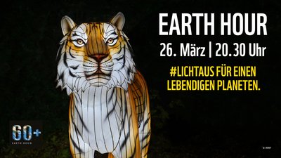 Löwe mit rechtsseitigem Text: Earth Hour, 26. März um 20:30 Uhr, Licht aus für einen lebendigen Planeten.